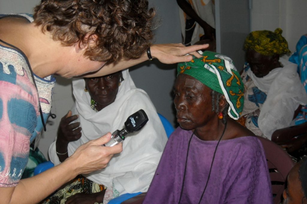 peace corps volunteers and Dr Judith Simon with patients